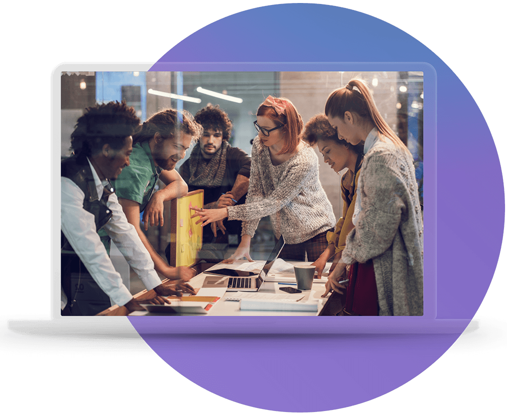 A cross-functional AICD team reviewing priorities together around a laptop